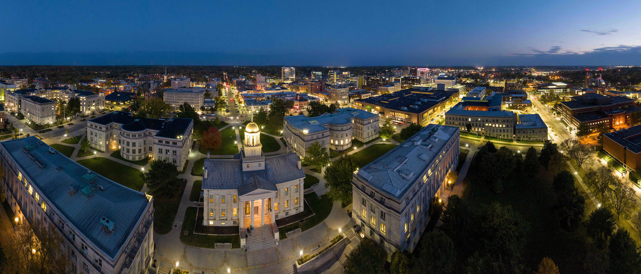 Panorama of downtown Iowa City at dusk.