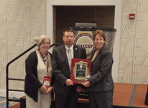 Cathy Noska and Dave Visin are presented with the Clery Compliance Program of the Year Award