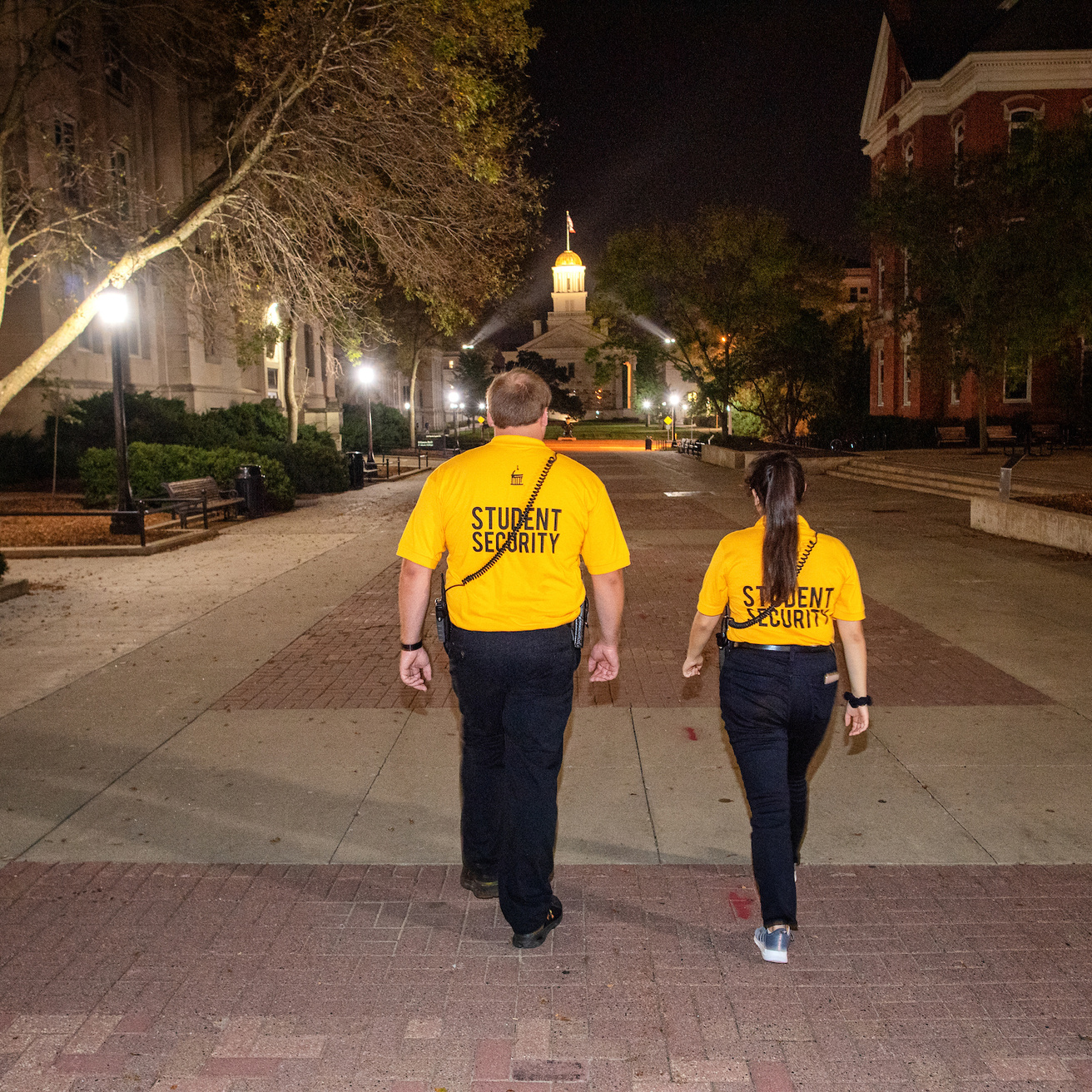 Student Security Officers walk along the T. Anne Clery Walkway