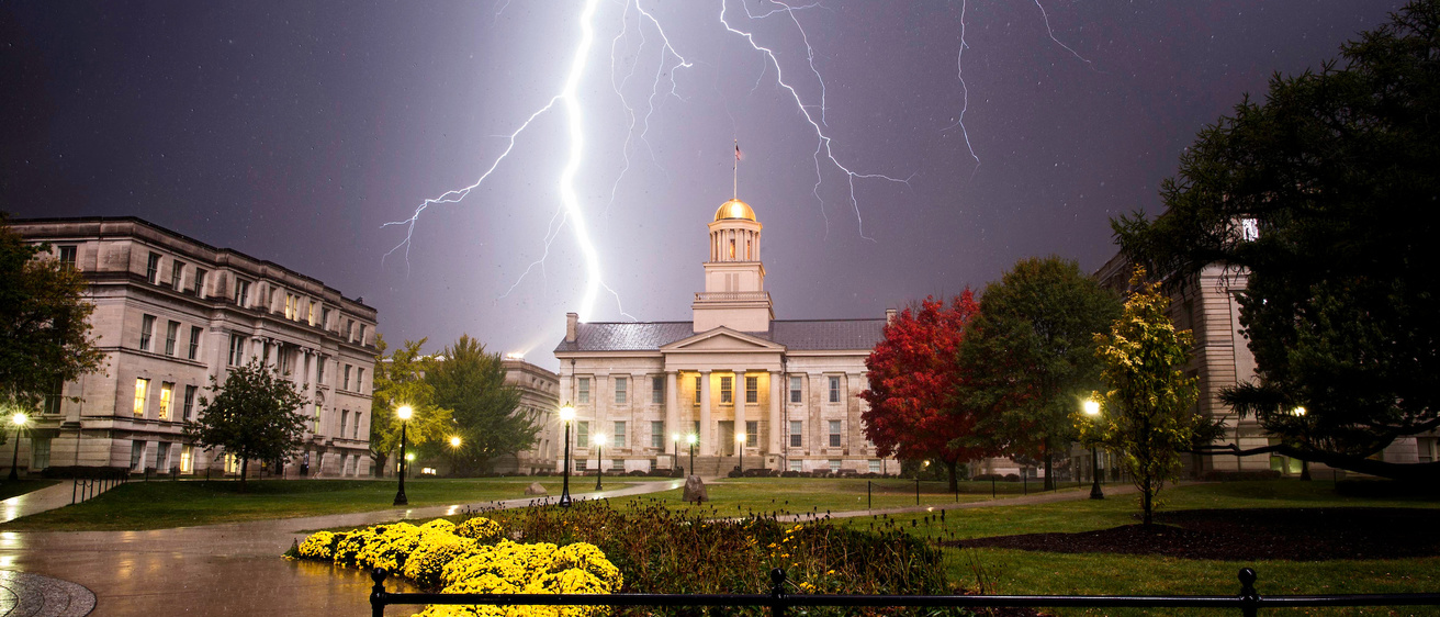 Lightning strikes behind the Old Capitol building.