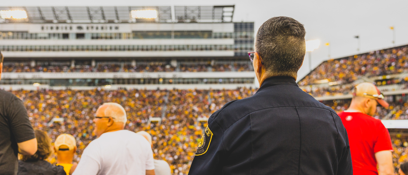 UI Police officer provides safety assistance during a Hawkeye Football game.