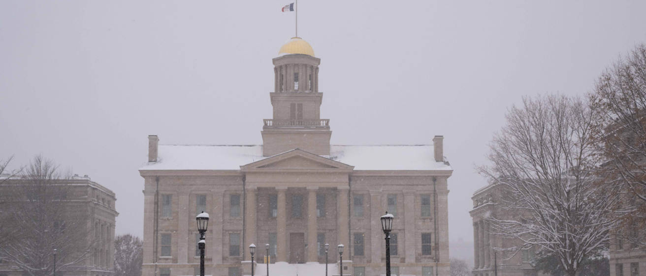 Fresh snow falls in front of the Old Capitol building.