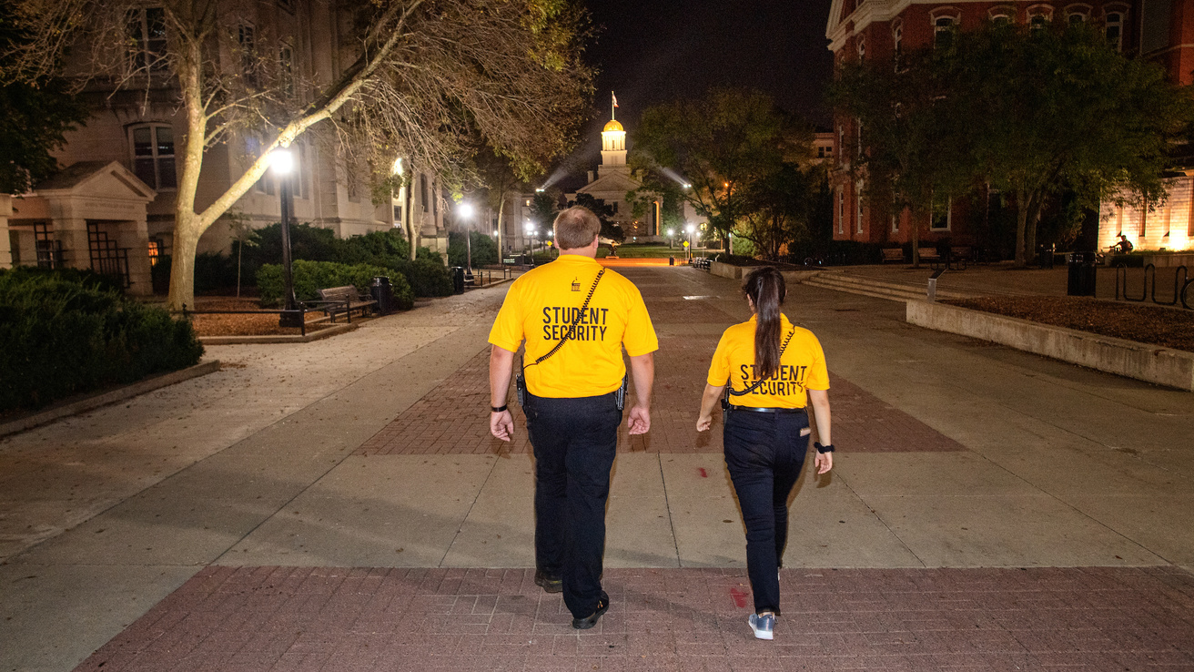 Student Security Officers walk along the T. Anne Clery Walkway